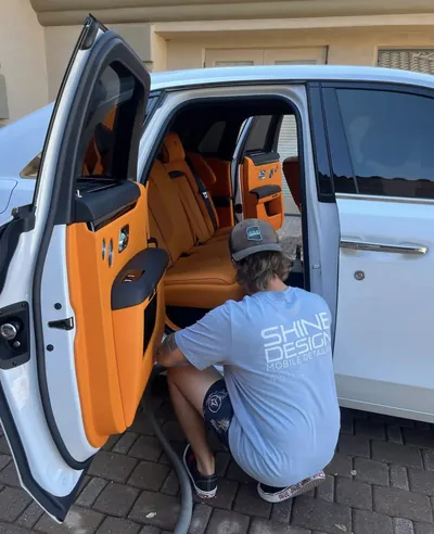 Mobile detailing service on luxury vehicle